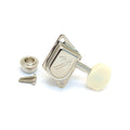Single nickel-colored guitar tuning machine head with beige plastic button, mounting bushing, and two screws on a white background.