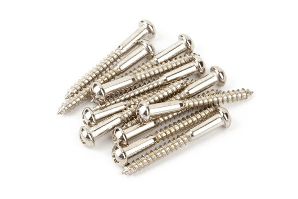 A pile of shiny silver metal mounting screws with Phillips heads on a white background.