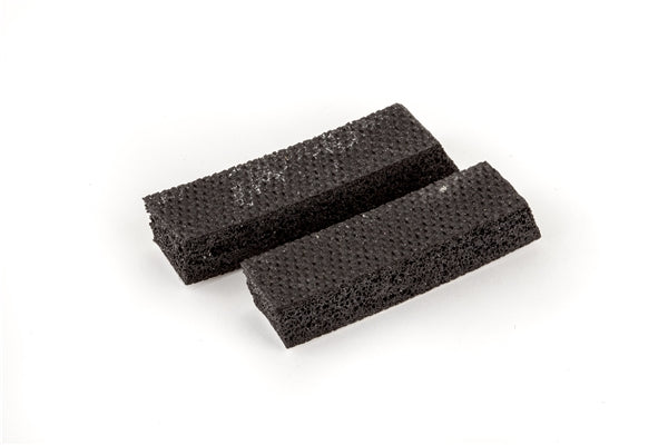 Two black rectangular foam strips on a white background.