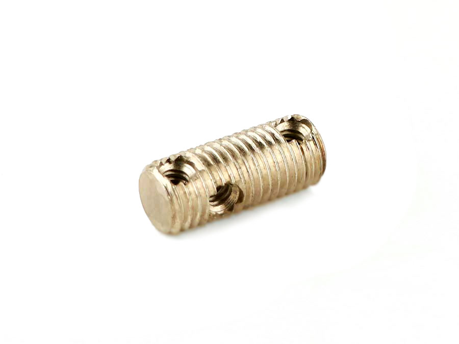 Small silver metal cylindrical part with multiple threaded holes on a white background.