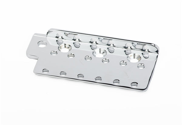 Chrome metal guitar bridge plate with multiple mounting holes on a white background.