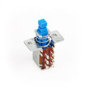 Blue push button switch with metal housing and six solder lug connectors on a white background.