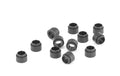 Twelve small black cylindrical plastic spacer bushings arranged on a white surface.