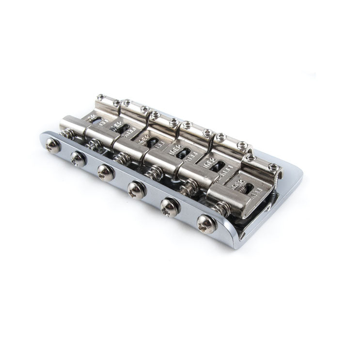 Metal guitar bridge with six string saddles and adjustment screws on a white background.