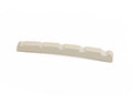 Off-white pre-slotted guitar string nut with five string slots on white background.