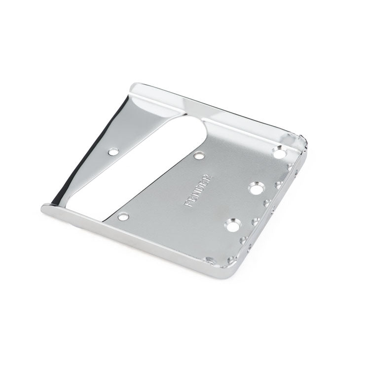 Silver metal guitar bridge plate with multiple mounting holes and 'FENDER' engraved text.