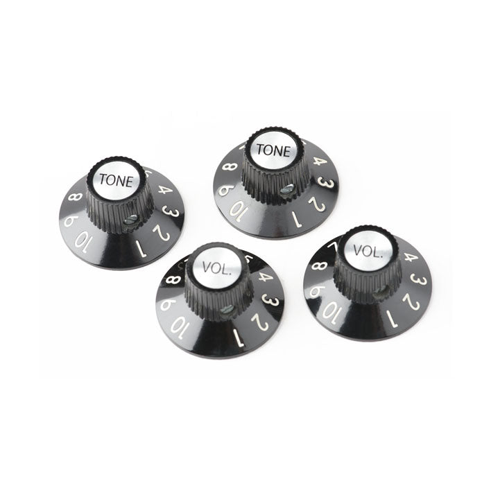 Black plastic control knobs labeled TONE and VOL. with numbers 1 to 10 around the edges.