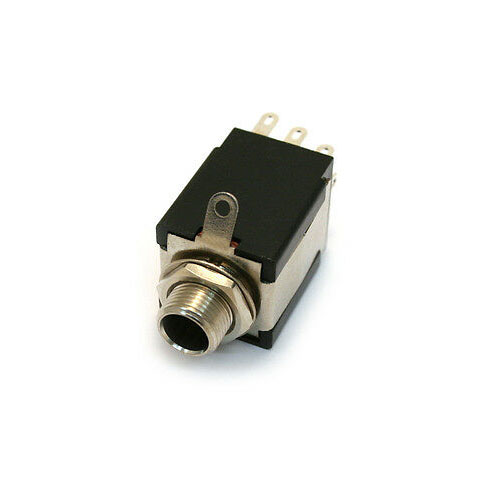 Close-up view of a 1/4 inch jack socket with three terminal pins and mounting hardware.