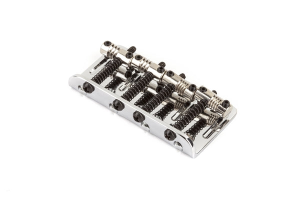 Silver metal four-string bass bridge assembly with adjustable saddles shown on a white background.