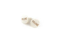 Two white circular knob caps labeled 'VOLUME' in brown text on a white background.