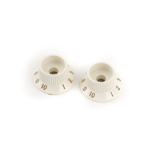 Two off-white rotary control knobs with numbers 1 to 10 marked around the edges on a white background.