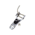 Polished metal vibrato tailpiece with lever and four screws on a white background.