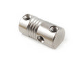 Close-up of a small cylindrical metal bridge saddle with three screw holes on a white background.
