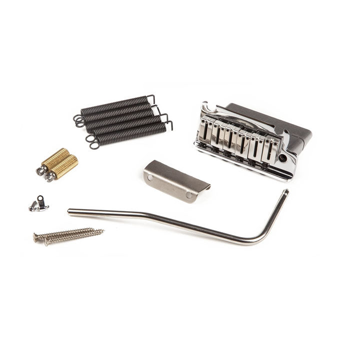 Metal guitar bridge assembly and related hardware parts on a white background.