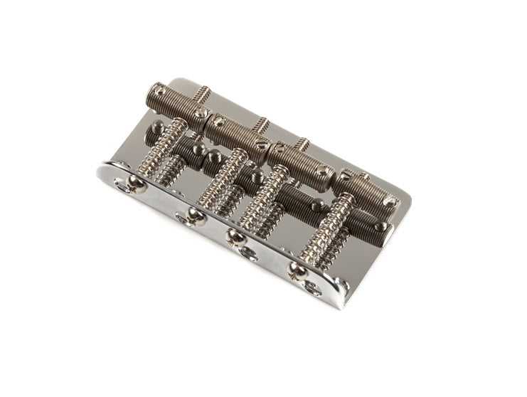 Metal guitar bridge component with four string saddles and adjustment screws on a white background.