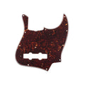 Brown tortoiseshell patterned guitar pickguard with 11 screw holes and cutouts for pickups and controls.