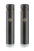 Front view of two identical black cylindrical microphones with gold logos on a white background.