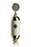 Front view of a metallic microphone with a round grille and a green logo on a white body.