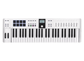 White MIDI controller keyboard with 49 keys, 8 pads, 9 faders, buttons, knobs, and a small display screen.