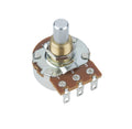 Close-up of a cylindrical potentiometer with a metal shaft and three solder lugs on a brown circuit board base.