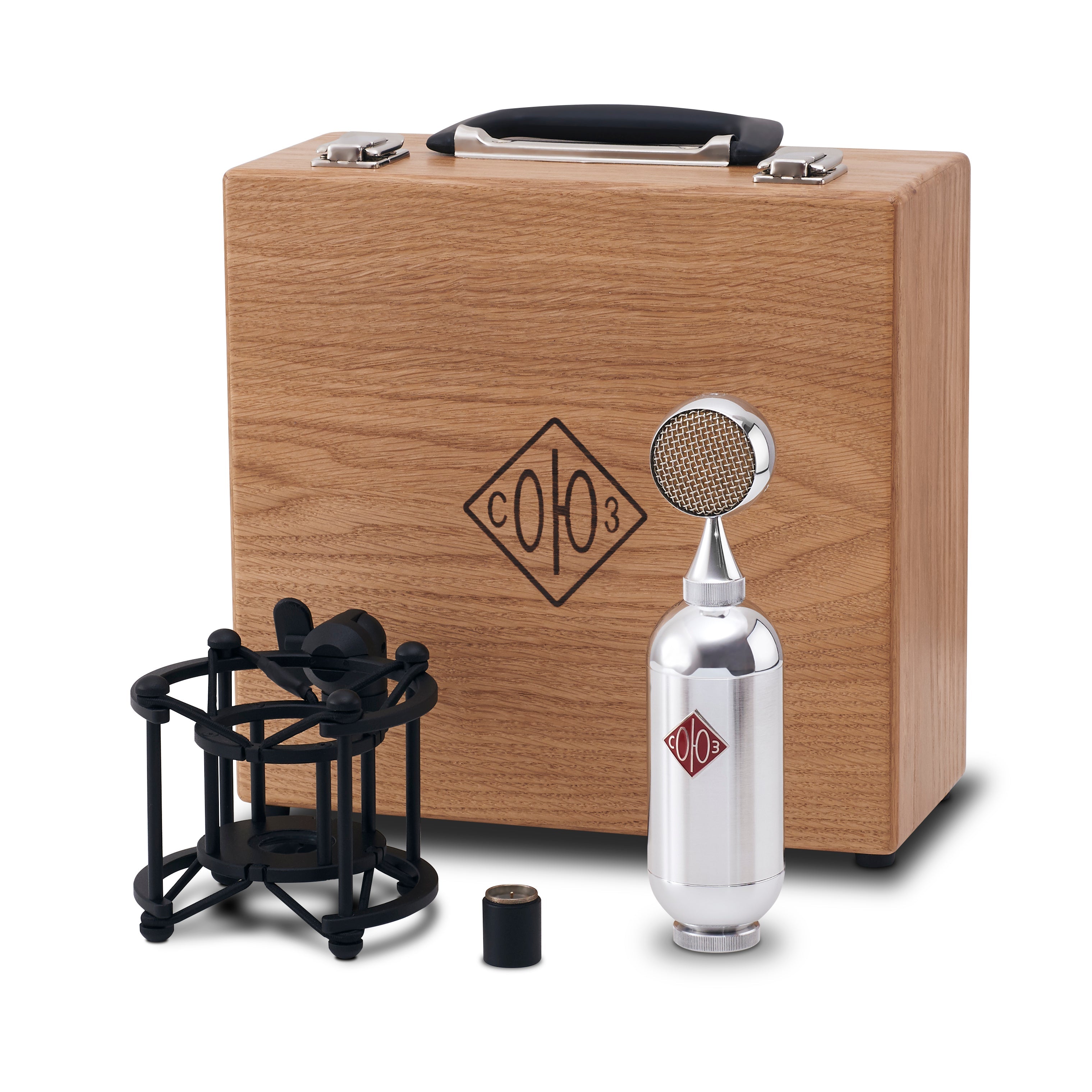 Silver bullet-shaped microphone with black shock mount, adapter, and wooden carrying case with logo.