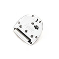 Silver metallic guitar tremolo plate with screws and a string anchor on a white background.