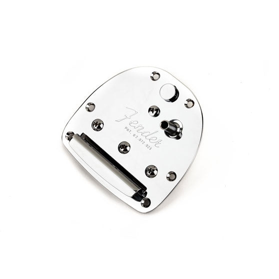 Silver metallic guitar tremolo plate with screws and a string anchor on a white background.