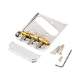 Chrome metal guitar bridge plate with three gold saddles, chrome cover, screws, and black allen wrench.