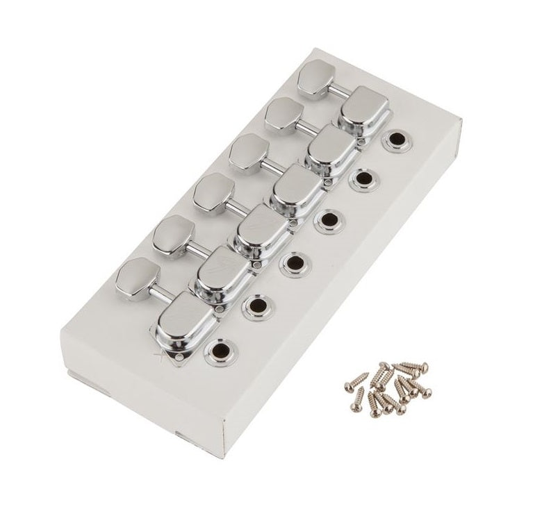 Set of six chrome guitar tuning machines with tuning pegs and mounting screws on a white surface.