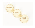 Three off-white plastic control knobs labeled Volume and Tone with numbers 1 to 10.