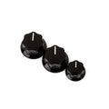 Three black control knobs of different sizes with white indicator lines arranged in a row.