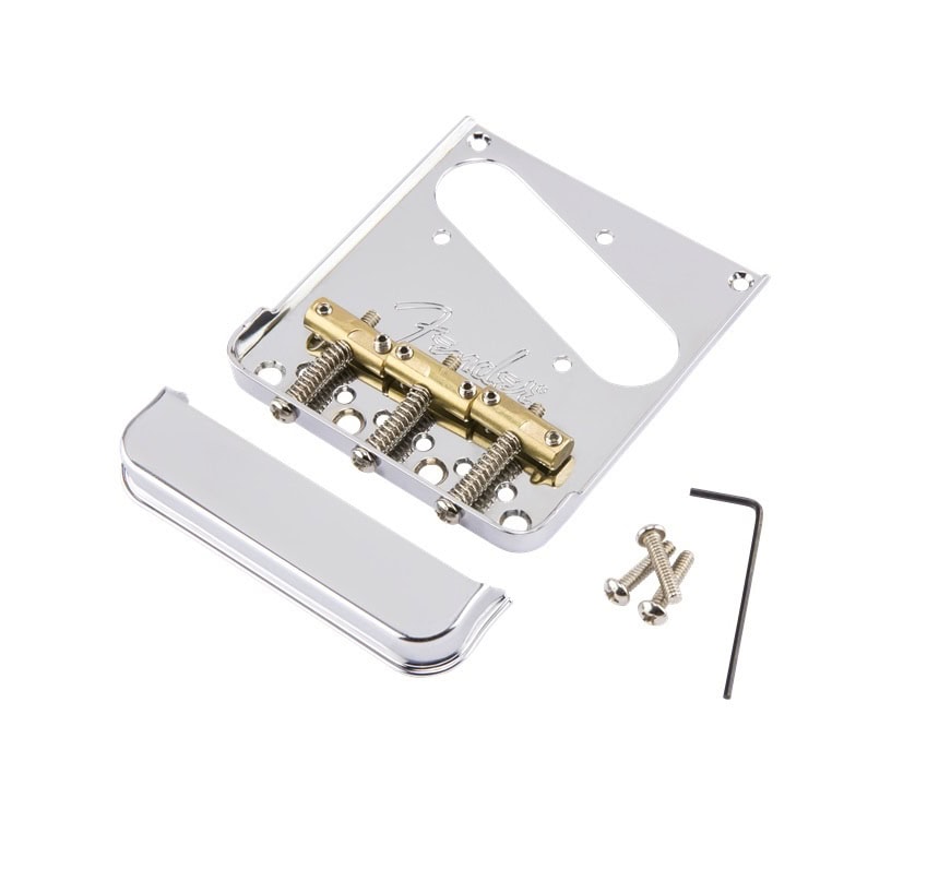 Chrome metal guitar bridge plate with three gold saddles, cover plate, three screws, and an L-shaped hex key.