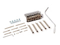 Chrome guitar tremolo bridge assembly with five springs, tremolo arm, various screws, bracket, and an Allen wrench on white background.