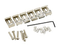 Six silver metal saddles with screws, springs, and a black hex key arranged on a white background.