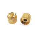 Two gold dome-shaped control knobs with textured grip surfaces shown on a white background.