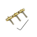Movable guitar saddle unit with screws and an L-shaped hex wrench on white background