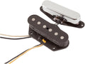 Two electric guitar pickups, one with a chrome cover and one black with visible pole pieces and attached wires.