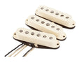 Three cream-colored single-coil electric guitar pickups with black bases and wire leads.