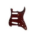 Tortoise shell style guitar pickguard with multiple holes and cutouts on a white background.