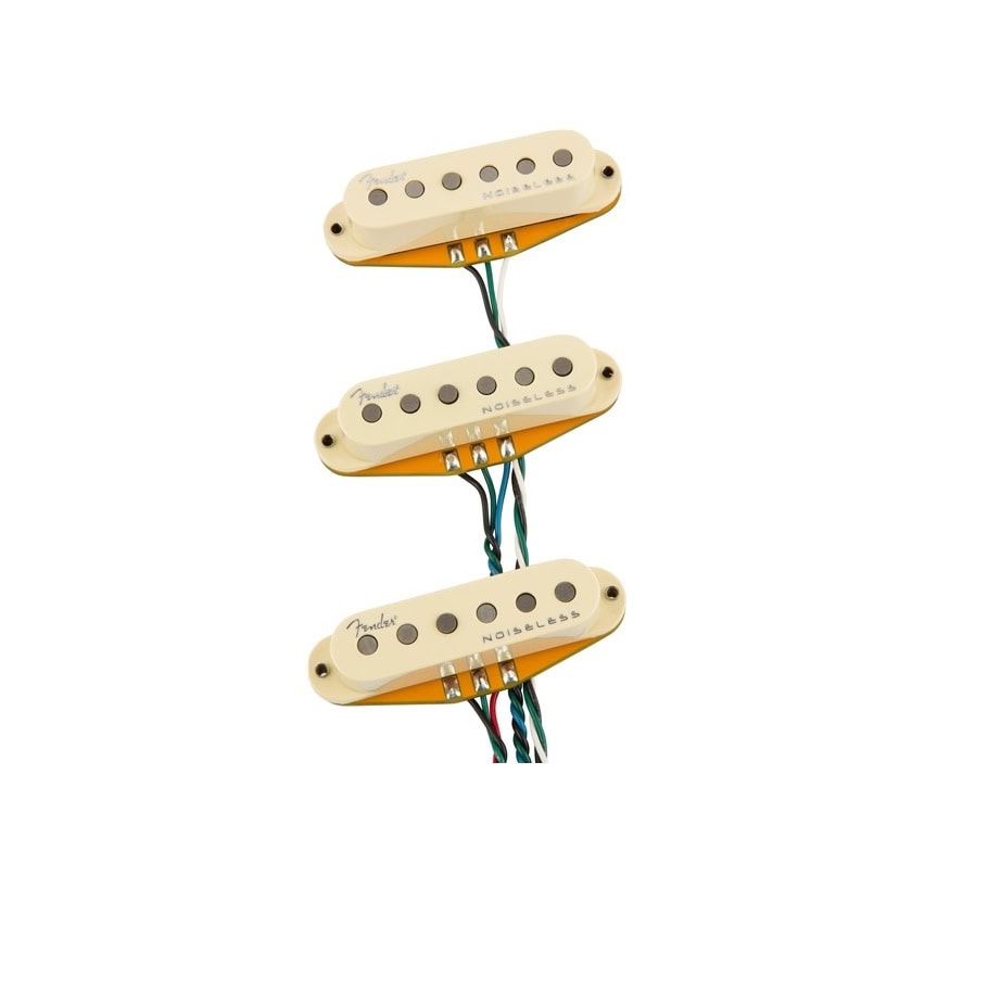 Three cream-colored single-coil electric guitar pickups with wires and visible magnet pole pieces.