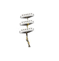 Three white single-coil style guitar pickups connected by wires on a white background.