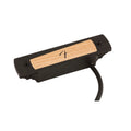 Black rectangular acoustic guitar pickup with a wood panel and an attached cable.