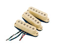 Three cream-colored guitar pickups with visible wires arranged in a row on a white background.