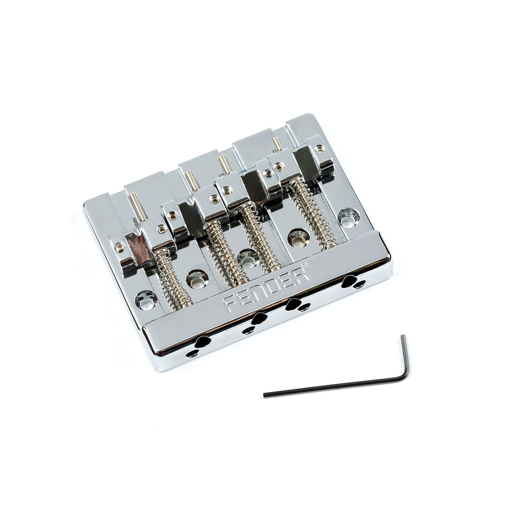 Chrome 4-string bass bridge assembly with adjustable saddles and included Allen wrench on white background.