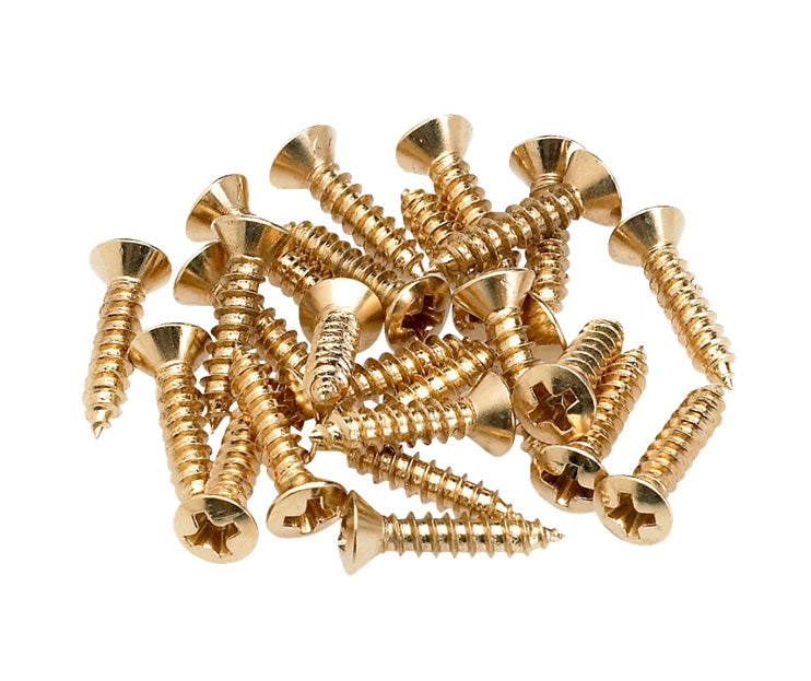 A pile of gold-colored metal screws with Phillips heads on a white background.