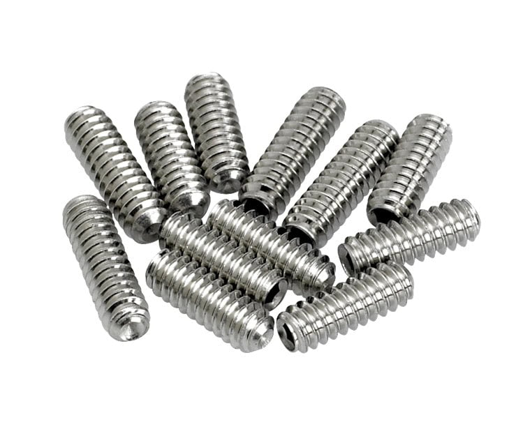 Twelve small silver metal threaded screws arranged loosely on a white background.
