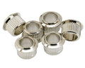 Six silver metal cylindrical bushings with ridged outer surfaces arranged in a group on a white background.