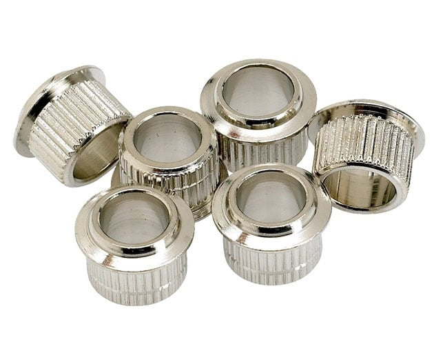 Six silver metal cylindrical bushings with ridged outer surfaces arranged in a group on a white background.