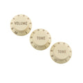 Three off-white rotary control knobs labeled VOLUME and TONE with numbers 1 to 10 around the edges.