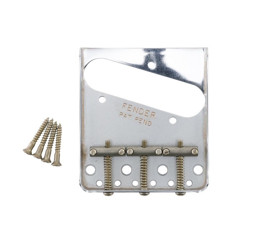 Metal bridge plate for guitar with three spring-loaded adjustment screws and five mounting screws beside it.
